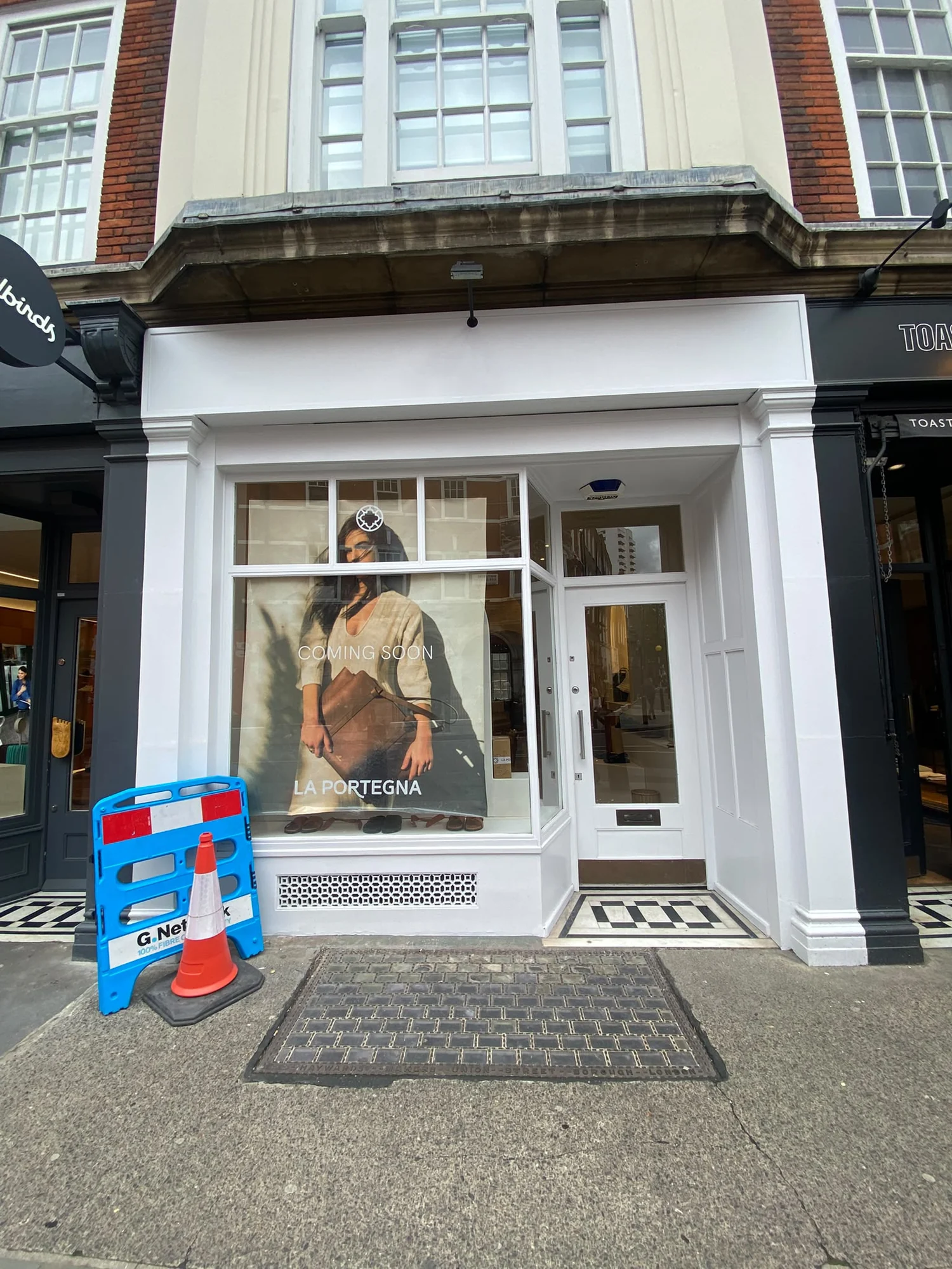 White painted shopfront from previous work