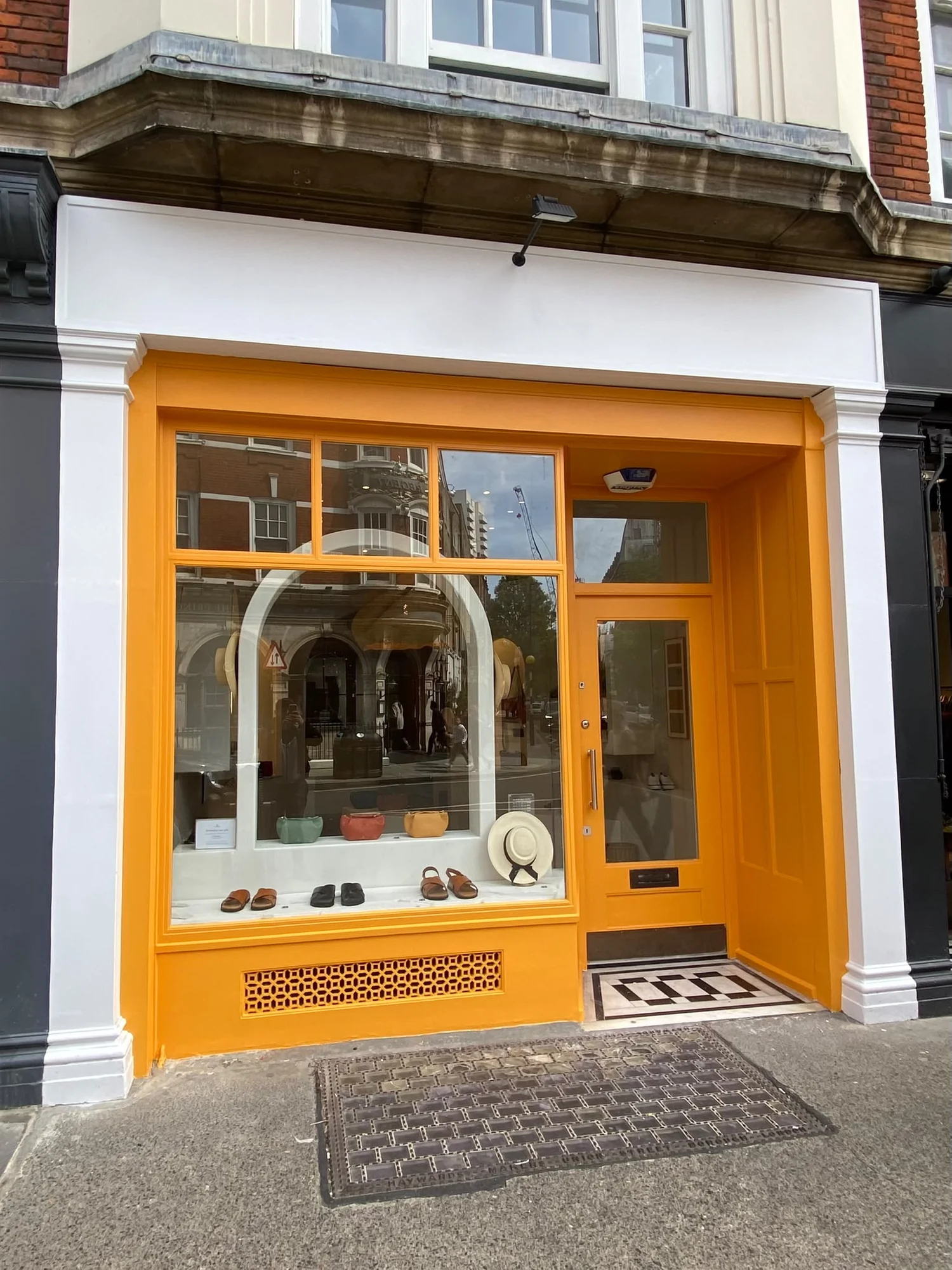 Yellow painted shopfront from a previous exterior project